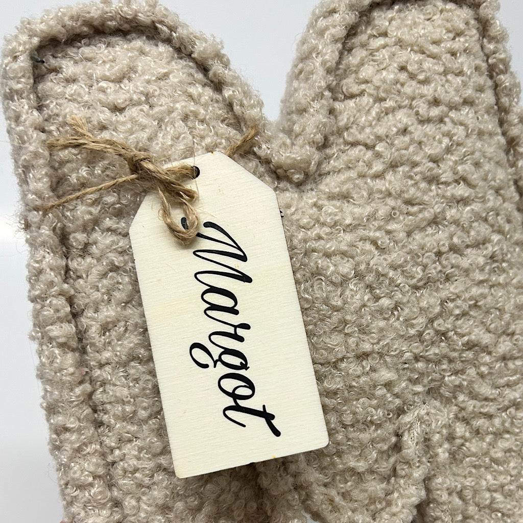 Bouclé fabric letter with wooden swingtag