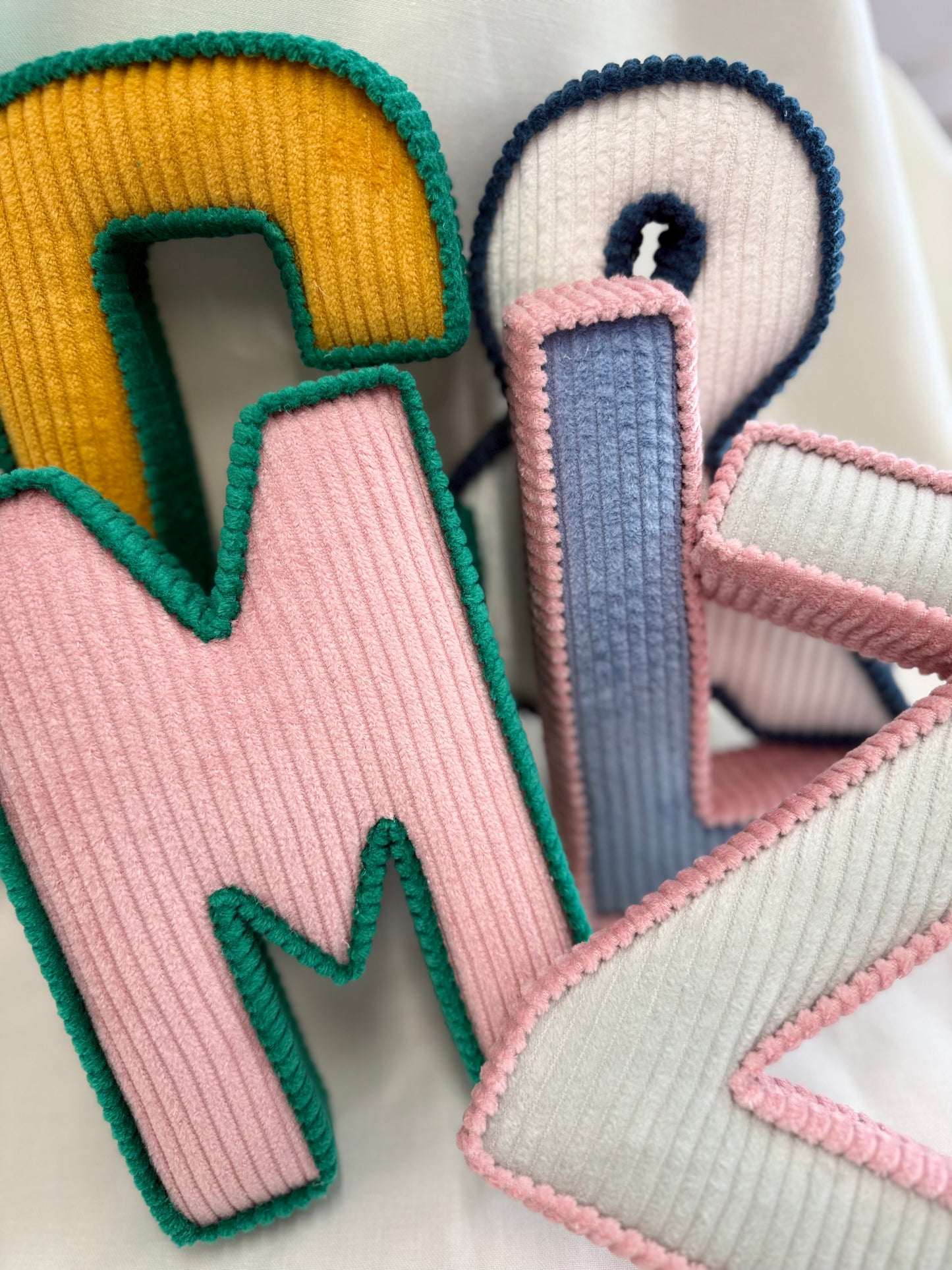 Contrasting trim corduroy letters