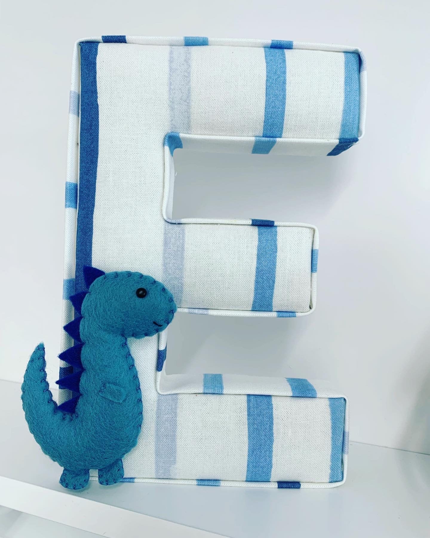 Personalised blue fabric letter with felt dinosaur