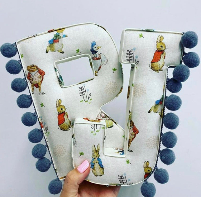 Beatrix potter fabric pompom letter.